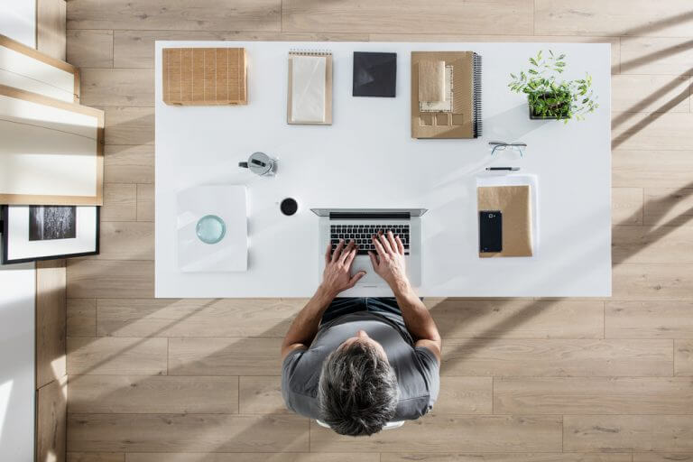 man working from a desk at home