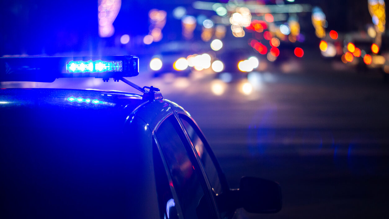 police car lights at night in city