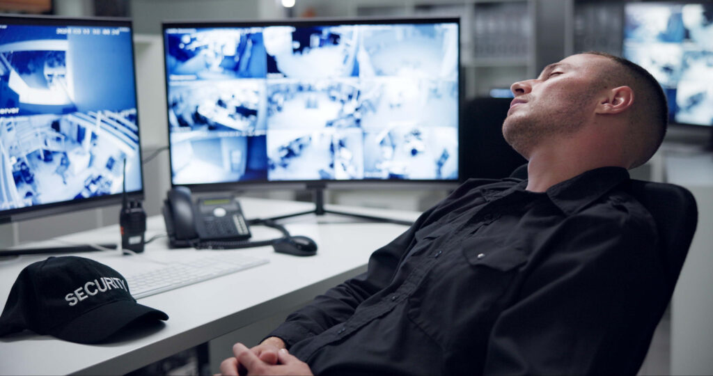 security guard asleep at his desk
