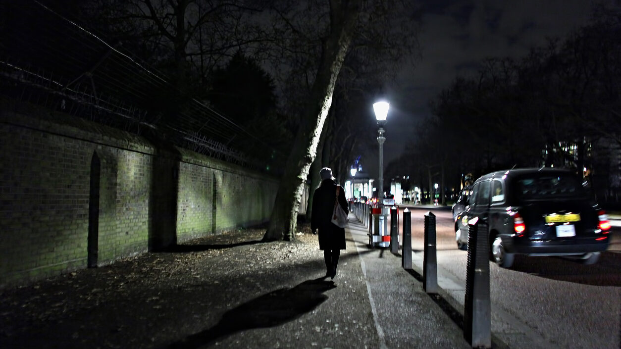 Woman walking alone in the dark