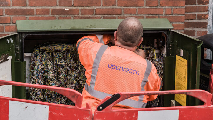 An Openreach engineer working on roadside telecommunications cabinet wiring