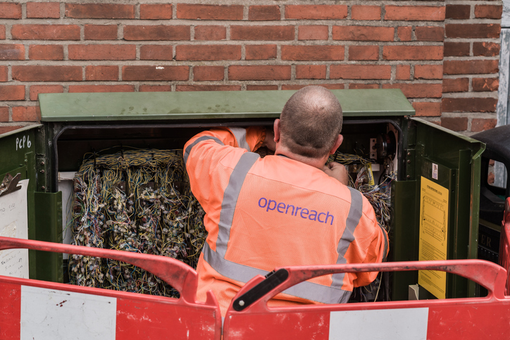 An Openreach engineer working on roadside telecommunications cabinet wiring
